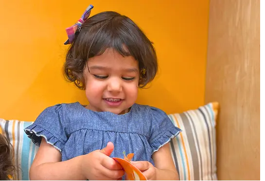 Child enjoying learning at Playgarden Prep inclusive classroom